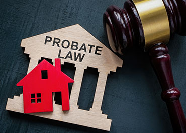 Gavel and house model illustrating smooth uncontested probate cases in Texas.